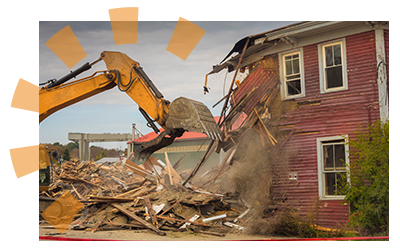 A red home being knocked down.