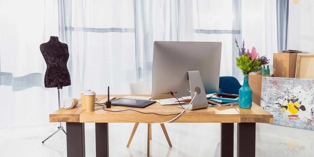 Desk With Mild Clutter in a Home Office. Source: Deposit Photos