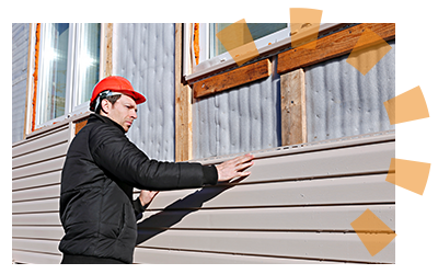 Homeowner unlocking and sliding vinyl siding panel.