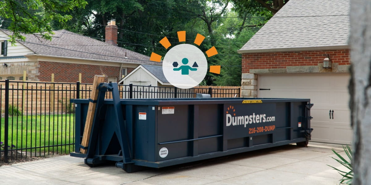 Dumpsters.com Roll Off Dumpster Sitting in Driveway Outside of Home