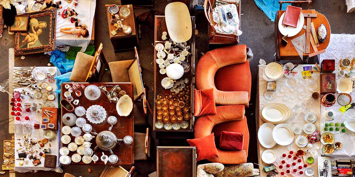 Birds Eye View of Dishes, Furniture and Odds and Ends Displayed at a Garage Sale.