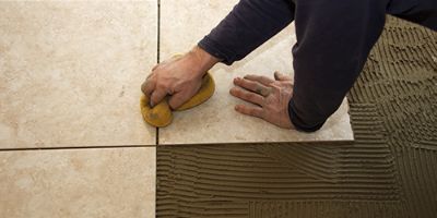 Broken Tile Next to Hammer