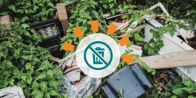 A pile of garbage contaminating the woods from illegal dumping. 