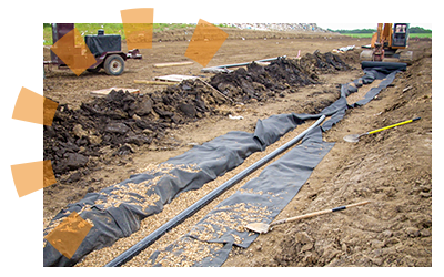 Installation of a double-lined leachate system.