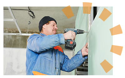 Man installing drywall with power tool.