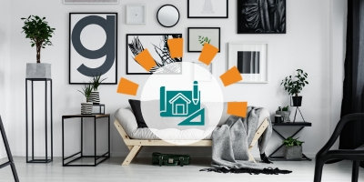 Black, white and grey living room designed with sofa, chair, tables, artwork and plants by interior decorator for blog website.