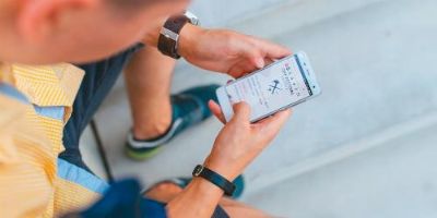 Using a sustainable app on mobile device.