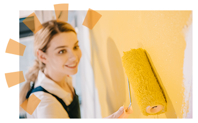 Female landlord painting apartment walls during apartment turnover for new renter. 