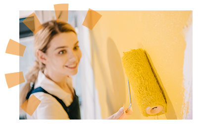Female landlord painting apartment walls during apartment turnover for new renter.