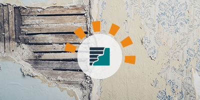 An old wall with antique wallpaper and damaged plaster for removal.