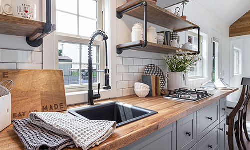 Modern tiny home kitchen designed by Liberation Tiny Homes in Lancaster, PA.