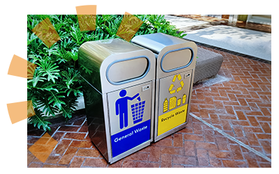 A clearly labeled general waste can next to a clearly labeled recyling can.