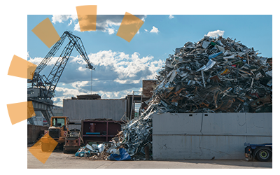 Materials heaped in a pile at a recycling center.