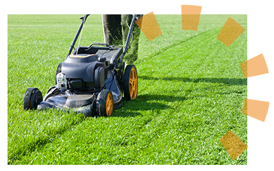 A man mowing a lawn with a push lawnmower.