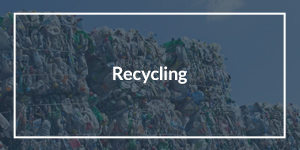 Recycling text overlaid on an image of a pile of bundled recycling