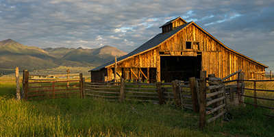 An old barn in a field waiting to be repurposed. 