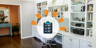 An organized and decluttered desk area featuring a wall-length white desk with white shelving to the ceiling and under cabinets and drawers.
