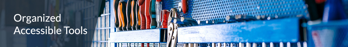 Garage wall of organized tools blue hanging rack for easy access.