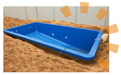 An in-ground pool is installed in a backyard.