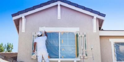 Man Painting Home Exterior.
