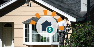 Homeowner prepping house for sale painting exterior.