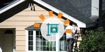 Homeowner prepping house for sale painting exterior.