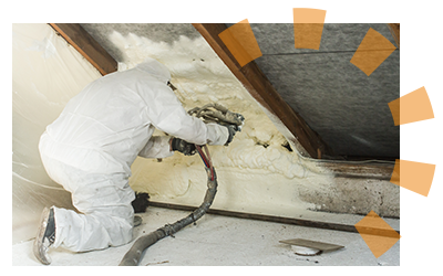 Protected worker spraying insulation foam.