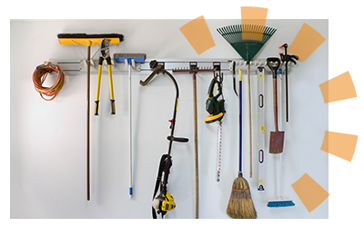 A wall of misplaced items rehomed in a neatly organized garage. 