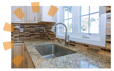 A stainless steel sink set into a countertop.