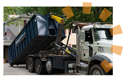 A Dumpsters.com dumpster containing old bathroom renovation materials. 