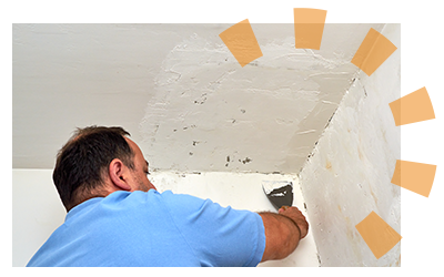 A seam between a wall and ceiling connected by spackle.