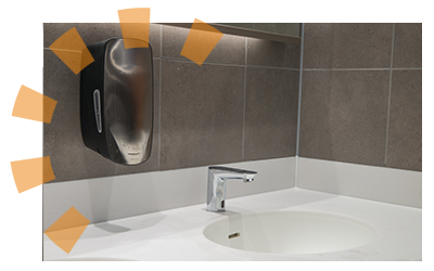 A commercial bathroom sink with automatic faucet and soap dispenser.