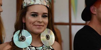 A Dress, Tiara and Earrings Made of Old CDs is Modeled at the ScrapsKC ReVision Upcycled Fashion Show.