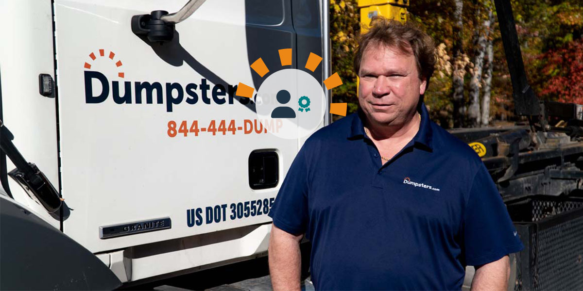 COO of Dumpsters.com's Cleveland Hauling Operations Rich Gersdorf Standing Next to a Dumpsters.com Truck.