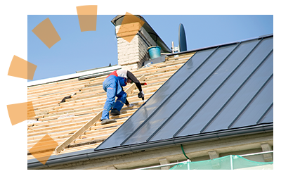 Roofer installs a gray metal roof.
