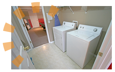 A simple laundry room with a washer and a dryer.