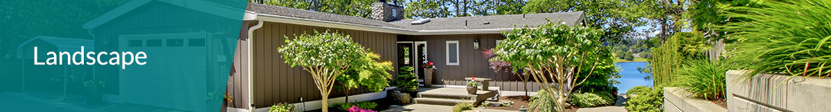 Single story home with tan siding and landscaping curb appeal on a lake.