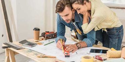 Couple Looking Over Home Improvement Plans.
