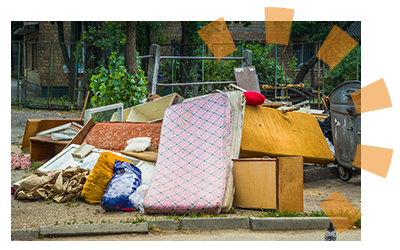 A pile of furniture left for curbside pickup.