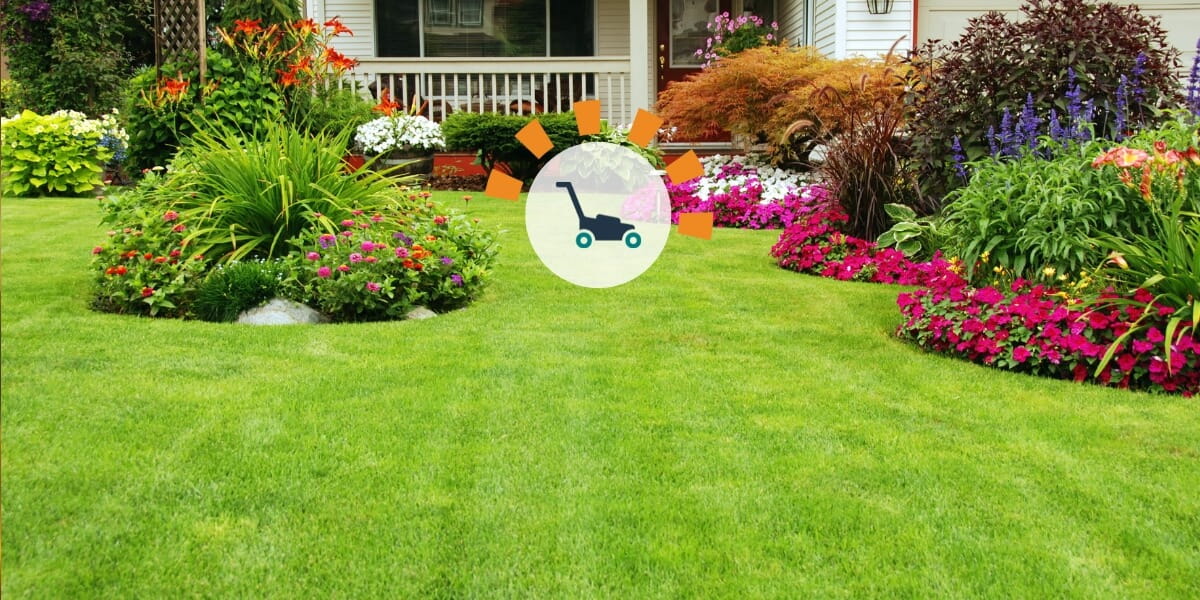 A well-manicured lawn with flowers, bushes and small shrubbery for landscaping accents.