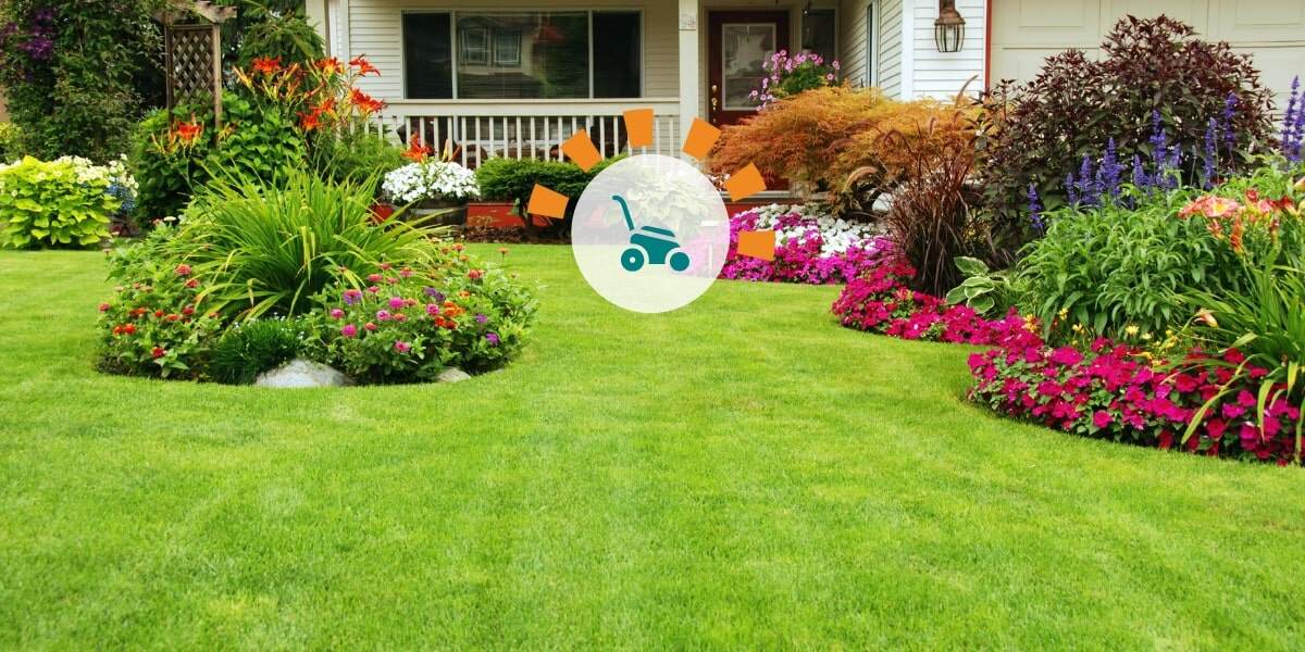 A well-manicured lawn with flowers, bushes and small shrubbery for landscaping accents.