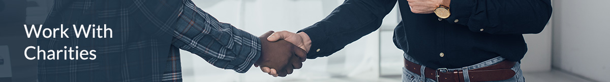 Two people shaking hands in an office.