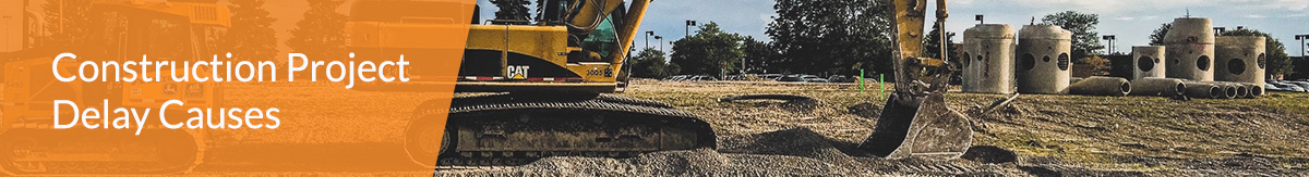 Two pieces of construction equipment sitting on a construction jobsite.