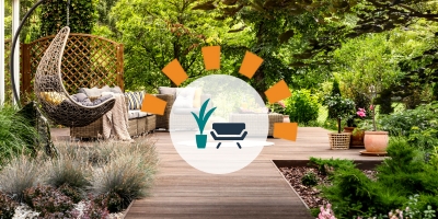 Updated backyard with wooden terrace, garden with potted flowers and wicker swing chair.