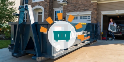 Dumpsters.com dumpster in front of brick home