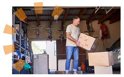 A man deciding what to keep when cleaning out his garage.