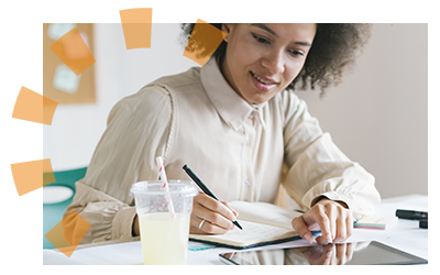 Woman planning her decluttering sentimental items goals.