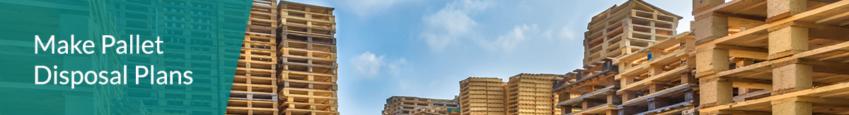 Stacks of wood pallets under a blue sky.