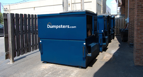 Front Load Dumpsters in Alley Behind Building.