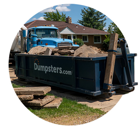 Dumpster Filled With Concrete on a Job Site